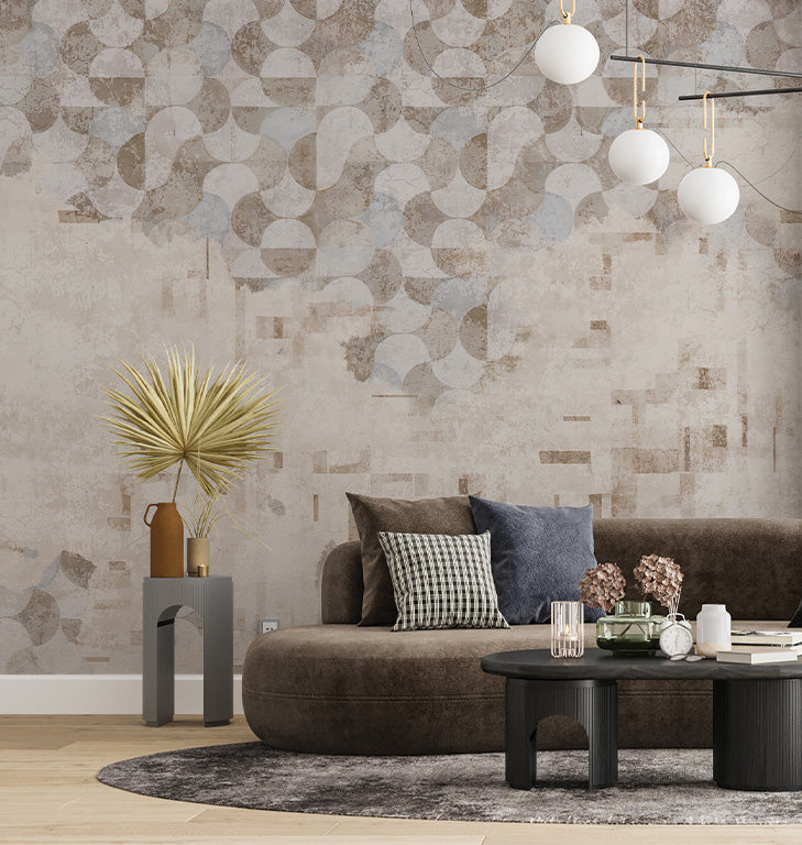 A modern wallpaper design featuring an abstract arrangement of geometric shapes, including overlapping circles and rectangles, in soft beige, gray, and muted blue tones. The textured, distressed background enhances its contemporary and artistic aesthetic.