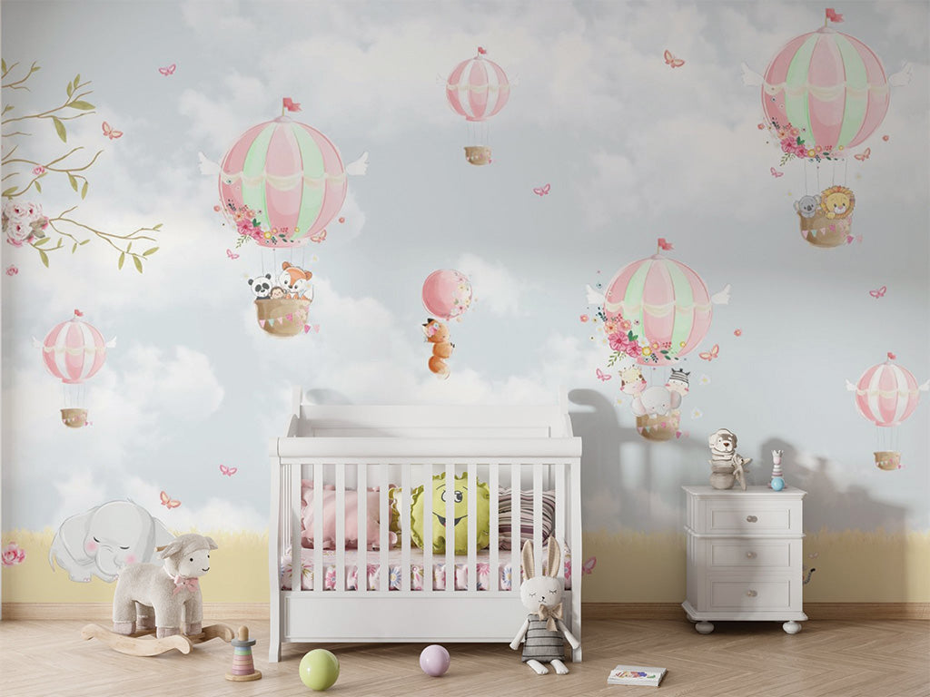 This delightful scene features pastel-colored hot air balloons floating in a soft sky with clouds, butterflies, and floral accents. Animals like pandas, foxes, and lions enjoy the ride in the balloons, while a bear cycles below and an elephant rests peacefully on the grass. A blooming tree on the left adds a touch of charm to this whimsical and serene illustration, ideal for children's decor or storytelling.