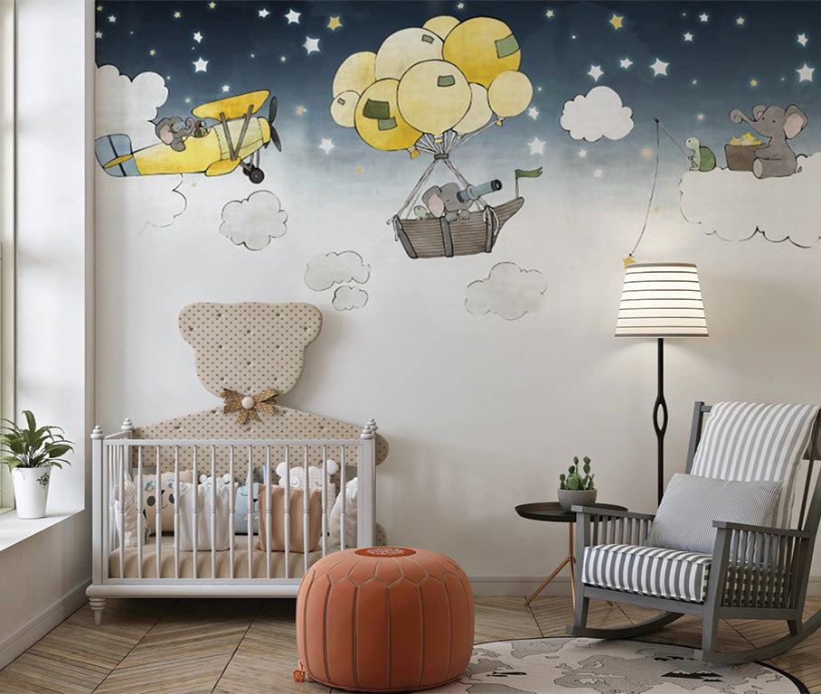 a whimsical nighttime scene with elephants engaging in playful activities among the clouds. One elephant pilots a yellow airplane, while another rides in a hot air balloon basket carried by yellow balloons. Nearby, an elephant on a cloud fishes for stars. The dark blue sky, dotted with stars, and the soft pastel colors create a dreamy, imaginative atmosphere perfect for children's decor.