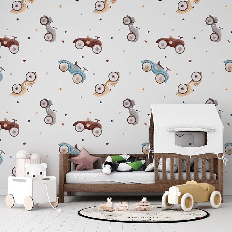 This seamless pattern features vintage toy cars in soft shades of blue, beige, and brown scattered across a white background, accompanied by small colorful stars. The whimsical design evokes a playful and nostalgic charm.