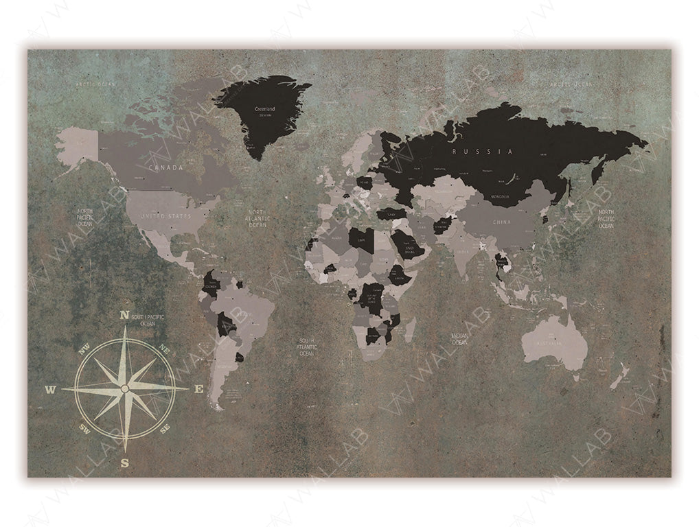 A vintage-style world map wallpaper mural featuring muted earth tones on a textured background. The map includes labeled countries, continents, and oceans, with a decorative compass rose in the bottom left corner. Ideal for adding a timeless, globetrotting vibe to office or living spaces.
