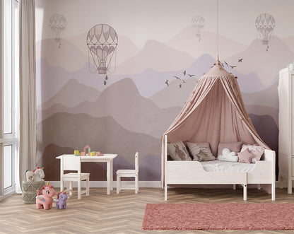 A serene mountain landscape in soft pastel hues, with hot air balloons floating in the misty sky and a flock of birds flying across the horizon. The minimalistic design exudes a peaceful and dreamy atmosphere.