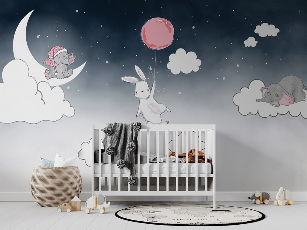This whimsical illustration features a dreamy night sky with a rabbit holding a red balloon, floating among clouds, a crescent moon, and twinkling stars. Nearby, a playful elephant sits on the moon while another sleeps on a cloud. The soft, dark-to-light gradient background adds a serene, magical feel to the scene, perfect for children's decor or storytelling.