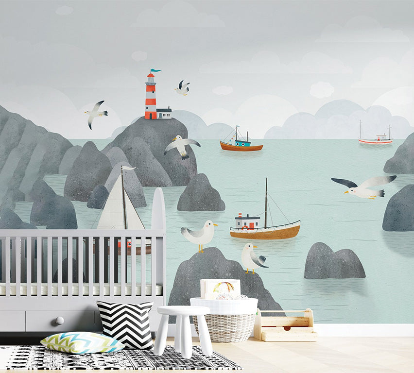 This whimsical illustration depicts a seaside scene with rocky cliffs, a red-and-white striped lighthouse perched on a rocky outcrop, and various boats floating in calm teal waters. Seagulls are scattered across the rocks and sky, adding to the coastal charm, while soft clouds create a serene atmosphere.